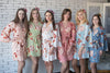 mismatched bridesmaids robes in flower print