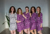 Bridesmaids in geometric aztec patterned getting ready robes