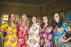 Give each of your bridesmaids a different color robe to get ready in