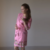 Pink colored sparrow themed robe to get ready in