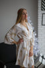 Champagne and gold wedding bridesmaids robes in feather print