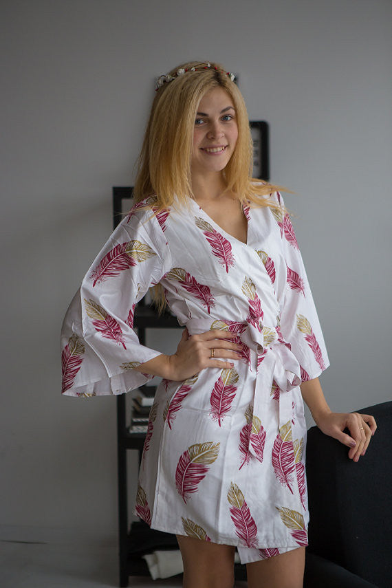 Plum and gold bridesmaids wedding robes in feather print