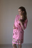 Pink colored sparrow themed robe to get ready in